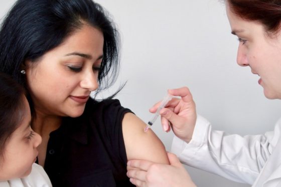 Woman receiving a vaccine